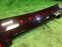 แผงตกแต่งระหว่างไฟท้าย SUBARU LANCASTER OEM 84251AE060 BHE 2001