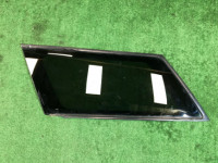 Стекло багажника левое 65210AE050NB SUBARU LANCASTER